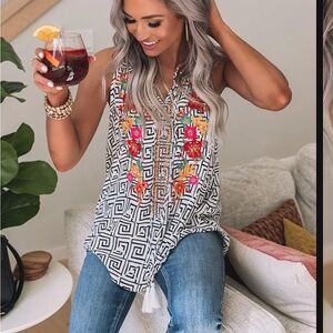 Shop impressions, sleeveless tunic, top with embroidered flowers. Size small.